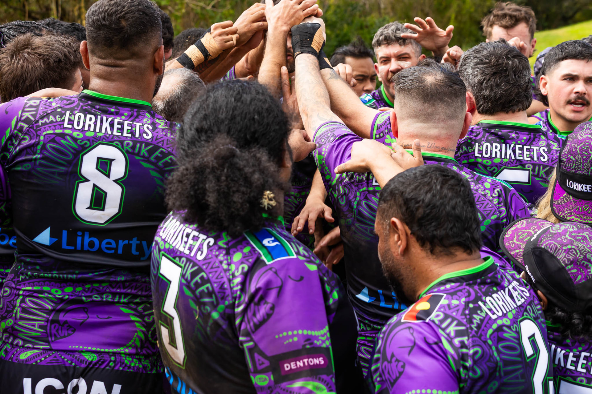 Lorikeets team celebration huddle