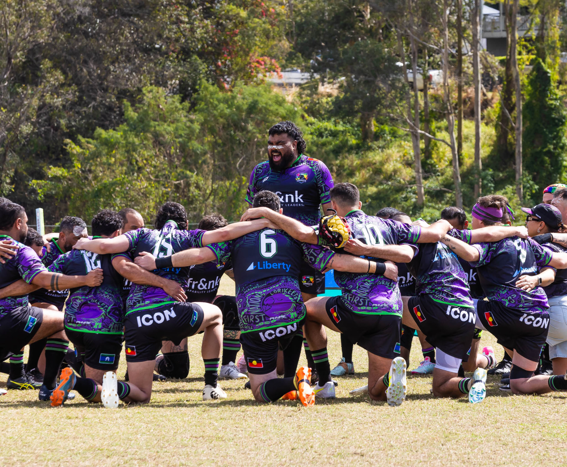 Lorikeets team huddle on the field